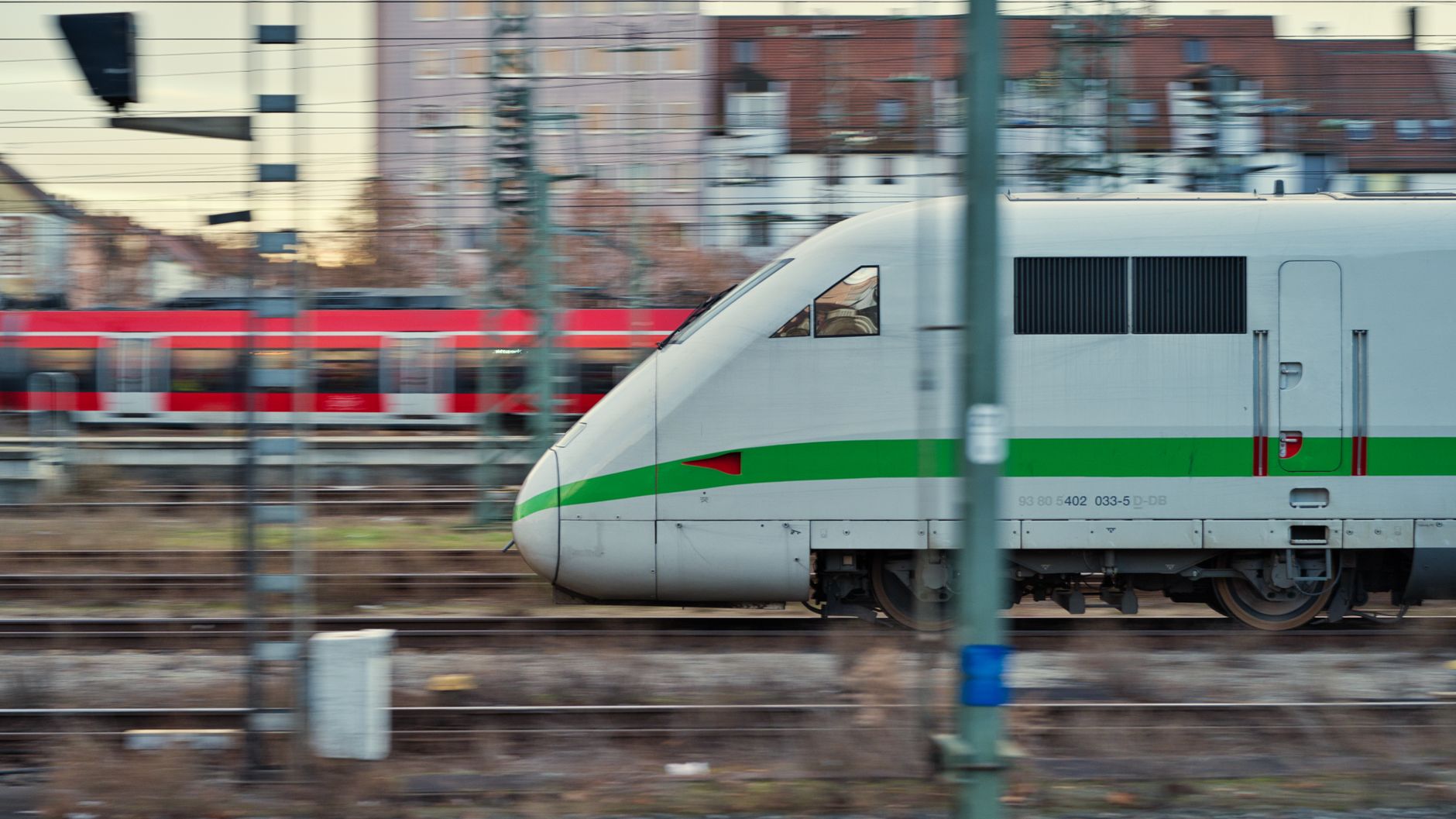high speed train moving on tracks sunset